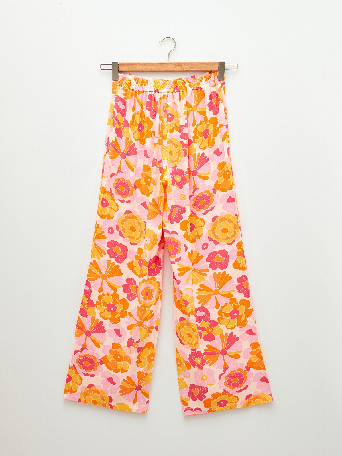 Look pantalon femme large imprime fleuri rose et orange taille 40 boutique Dakar